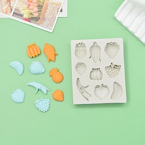 Multi-cavity silicone fruit mold for fondant and chocolate featuring strawberry and banana shapes