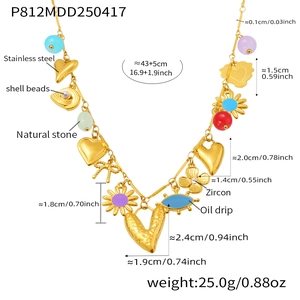 Detail view of colorful heart necklace with stainless steel charms and shell beads
