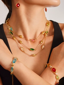 Macro detail of luxury multi-layered necklace set with colorful faceted bohemian stones