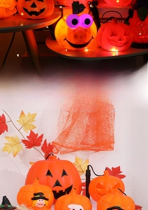 Detail showing glowing orange Halloween pumpkin lanterns with LED lights and wizard hats