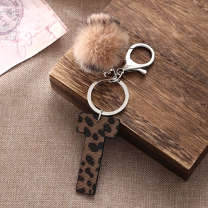 Western leopard print leather letter T keychain with brown faux fur pom pom and silver hardware