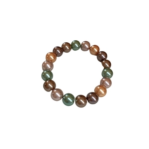 Bracelet de perles vintage français avec perles multicolores marron et or sur blanc