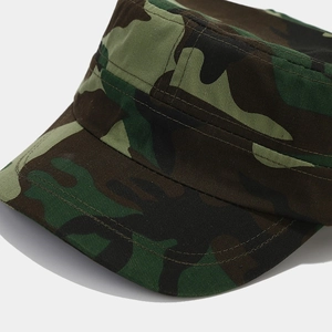 Detailed macro view of the camouflage military cap showing premium stitching and fabric texture