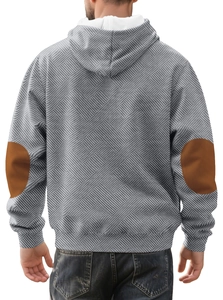 Detail view of men's grey hoodie featuring geometric patterns and brown elbow patches