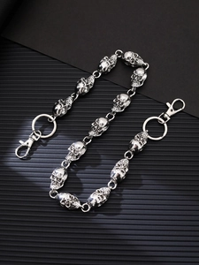 Close-up of vintage silver skull metal pants chain with detailed punk hip-hop design