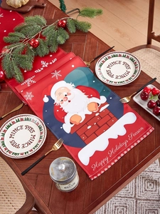 Detail of red Christmas table runner with Santa Claus and Happy Holidays Season text