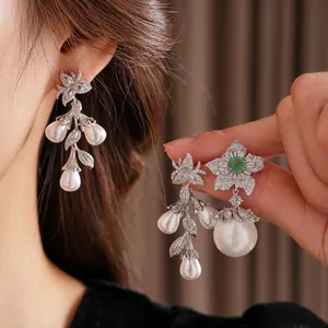 Vintage floral earrings with waterdrop pearls and green gemstone in silver finish