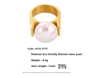 Detail view of 1.6cm faux pearl ring made of gold plated titanium steel weighing 8.3g