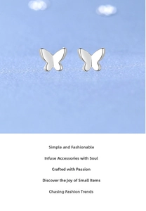 Detailed macro view of S925 sterling silver butterfly stud earrings with polished finish