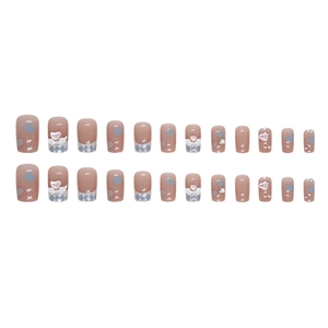 Blue heart and plaid patterns on pink press-on nails with 3D angel wing charms