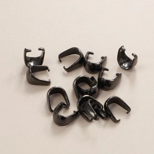 Close-up of polished black stainless steel U-shape pinch bails for DIY jewelry making