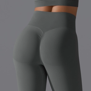 Detail view of high waisted seamless yoga pants with scrunch butt lifting design in dark grey