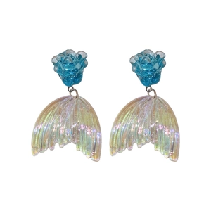 Elegant acrylic blue flower earrings with iridescent fishtail charms on a white background