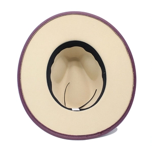 Interior detail of wide brim felt fedora showing contrasting purple and beige colors