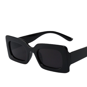 Trendy retro black square sunglasses with thick frames shown from a 45-degree angle