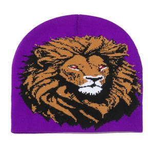 Close-up of purple knit beanie featuring a vibrant lion head embroidery for winter