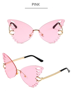 Detail of pink butterfly rimless sunglasses with gold metal frame and gradient lenses