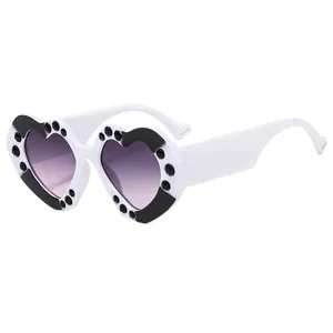 Fashionable heart-shaped sunglasses with white frames and purple gradient lenses