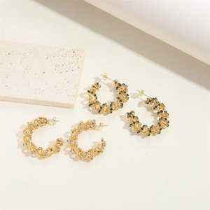 Twisted rope hoop earrings in 14K gold plating with white and green zircon accents