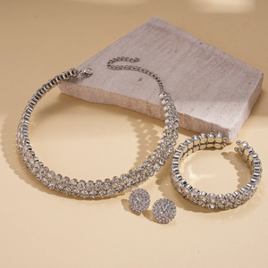 Detailed view of luxury geometric rhinestone necklace set on decorative stones