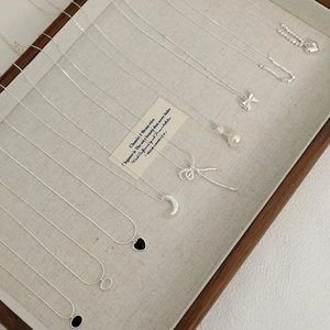 S925 silver necklaces with freshwater pearl, heart and moon pendants in jewelry tray