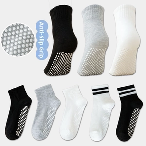 Detail of anti-slip silicone dots on the sole of breathable cotton mesh children socks