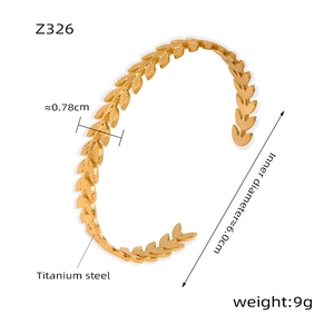Detail view of gold titanium steel wheat ear cuff with size and weight dimensions