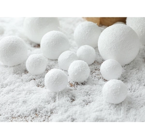 Detail of assorted white flocked snowballs for Christmas tree decoration with soft texture