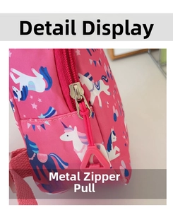 Detailed macro of pink unicorn print canvas and smooth metal zipper with a cord puller