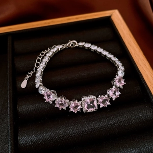 Close-up of pink cubic zirconia bracelet with silver chain and adjustable lobster clasp