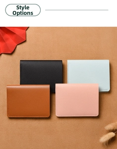 Flat lay of slim leather card holders in four colors with elegant lychee texture