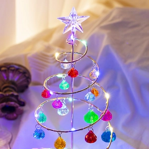 Detailed close-up of a spiral iron Christmas tree with colorful acrylic crystal drops