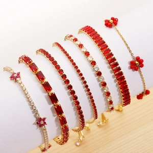 Elegant gold-plated tennis bracelet set with red and white zircon gemstones display