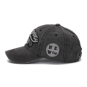 Detail of vintage washed grey cotton baseball cap with 3D embroidery and side patch