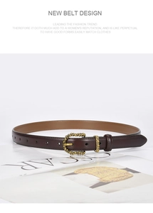 Close-up of brown leather belt with gold-tone buckle on a minimalist magazine backdrop