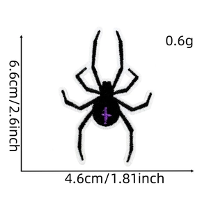 Detailed view of black spider embroidery patch with purple cross showing size 6.6cm x 4.6cm