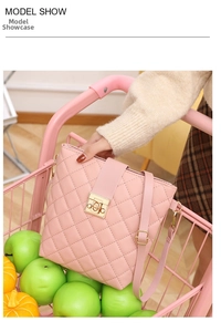 Quilted pink bucket bag featuring a golden twist lock and adjustable shoulder strap