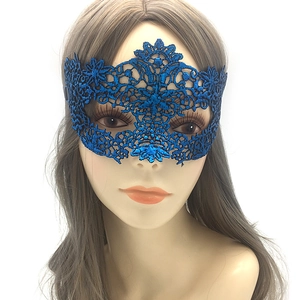 Close-up of royal blue lace masquerade mask with intricate floral embroidery details