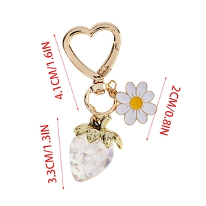 Detailed size view of strawberry keychain with heart clasp and daisy charm charm