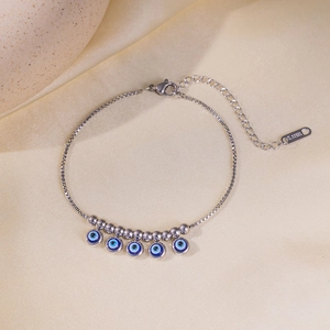Bracciale in acciaio inossidabile argento con cinque ciondoli occhio blu su seta