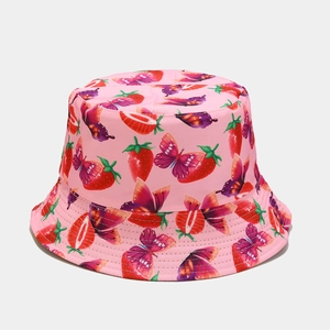 Detailed pattern of red strawberries and colorful butterflies on pink cotton bucket hat