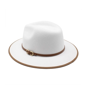 Detail of white wool fedora hat with brown leather band and gold horseshoe buckle