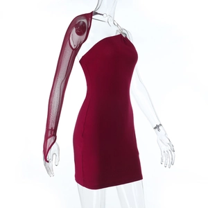Detail of burgundy asymmetric dress with metal ring and sheer mesh long sleeve