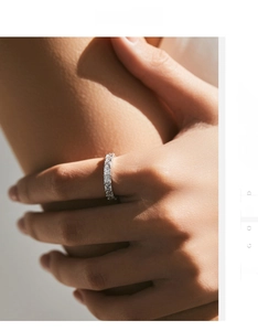 Detail of s925 sterling silver ring featuring sparkling square-cut eternity diamonds