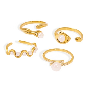 Set of four gold stainless steel pearl rings with adjustable irregular geometric designs