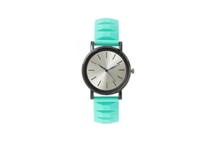 Close-up of mint green silicone watch strap with 3D geometric texture and silver dial