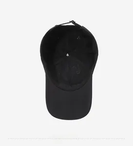 Detail view of the black baseball cap showing the breathable mesh lining and stitching