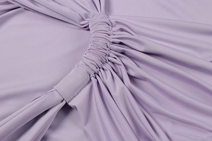 Close-up of premium purple ruched fabric showing fine texture and elasticity details