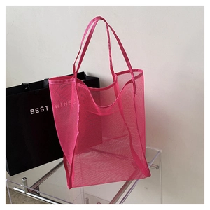 Close-up of breathable rose pink mesh tote bag with wide handles for beach and shopping