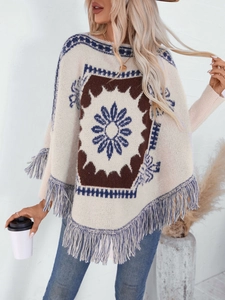 Vintage boho knit poncho sweater with geometric patterns and blue fringe trim